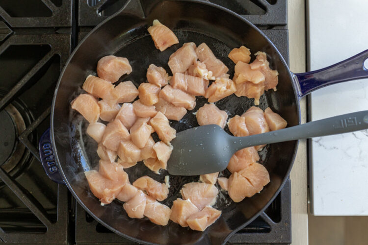 Chicken cooking in a pan