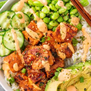 Salmon Maki bowl assembled with rice, salmon, avocado, cucumbers, edamame and spicy mayo.