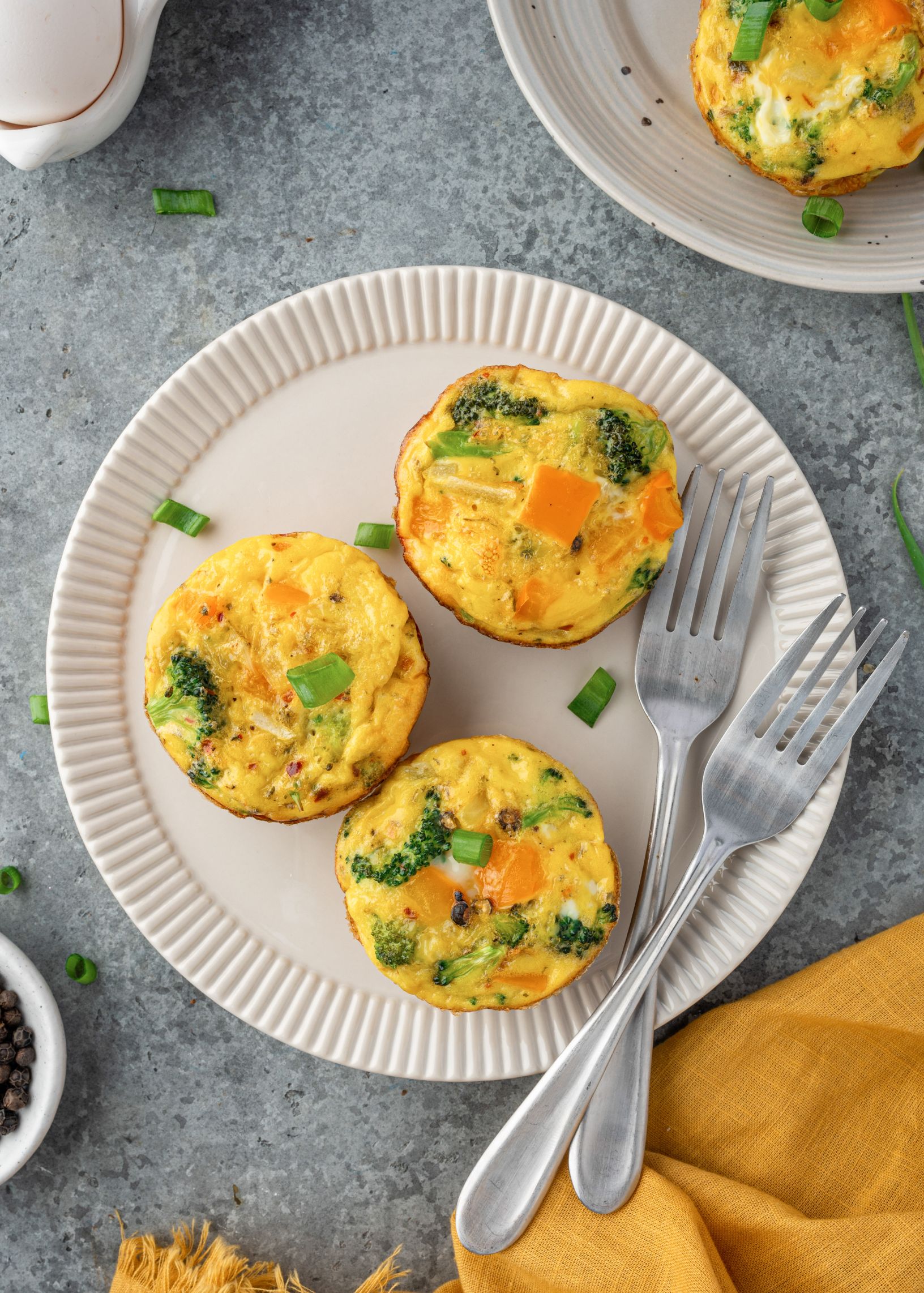 Three egg muffins on a white plate.