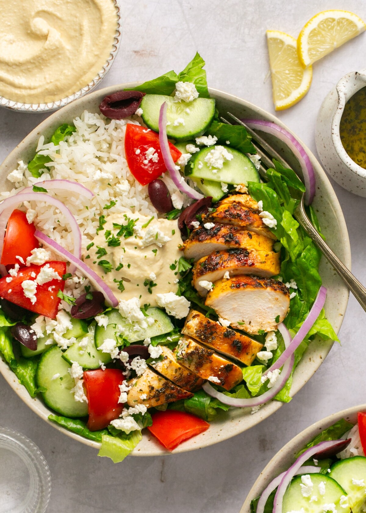 Mediterranean chicken bowls topped with feta cheese